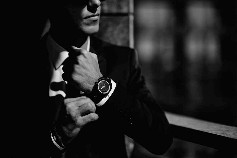 Businessman checking watch in a corporate setting