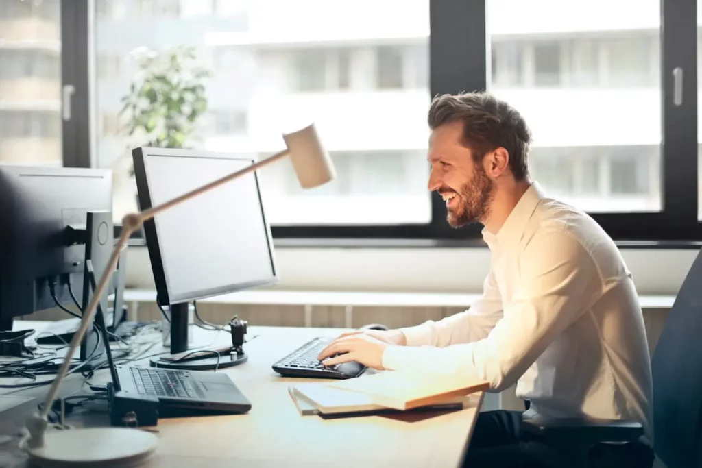 A real estate agent watching as emails or notifications are sent automatically.