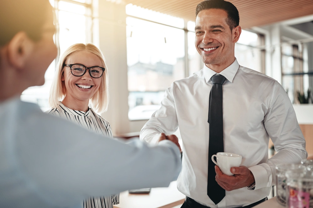 A realtor working alongside a team of business consultants, discussing a strategic growth plan.