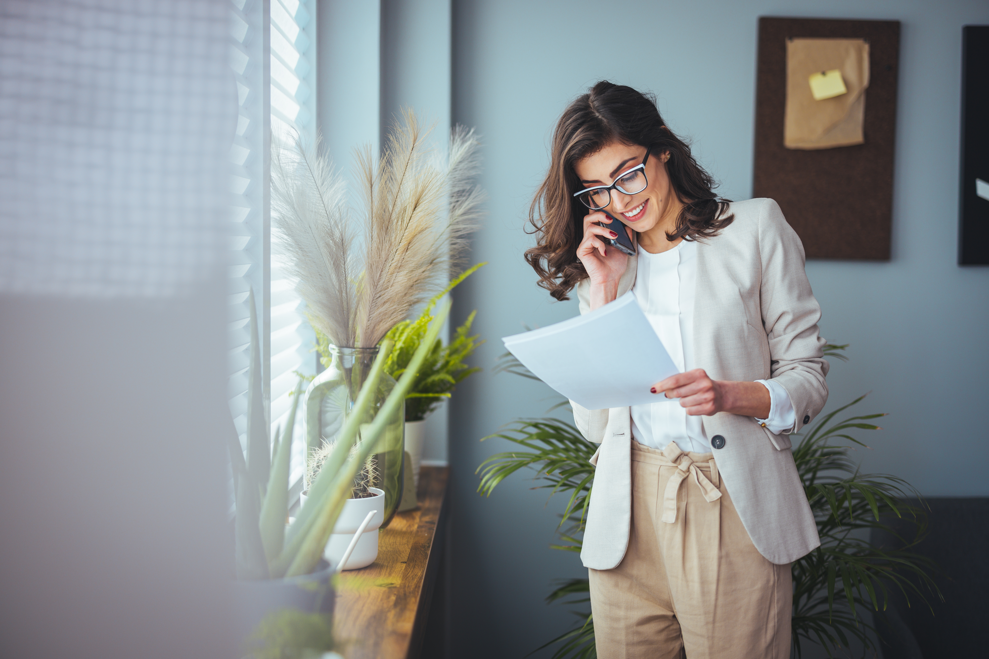 Woman on the phone trying to handle real estate transactions