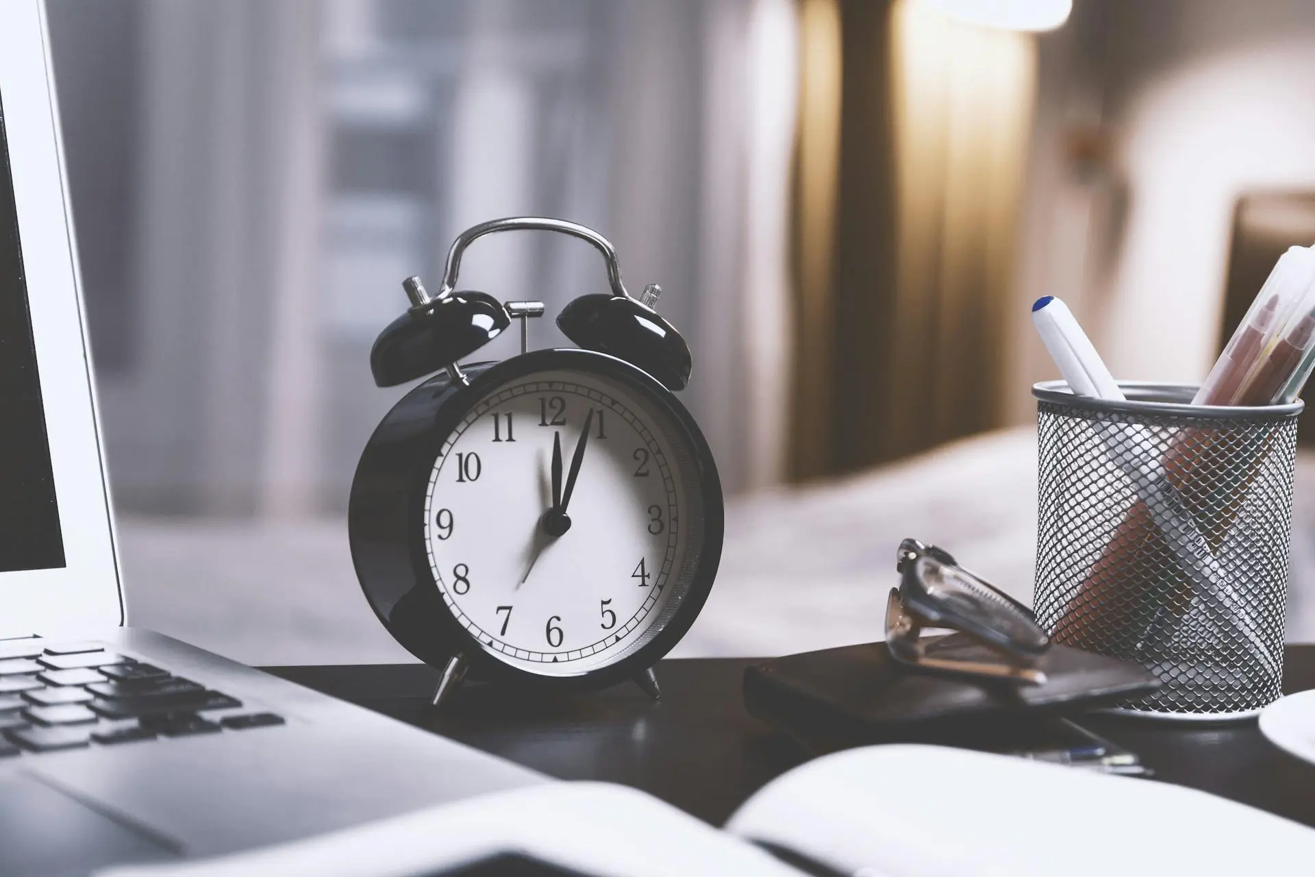 Clock on a messy desk