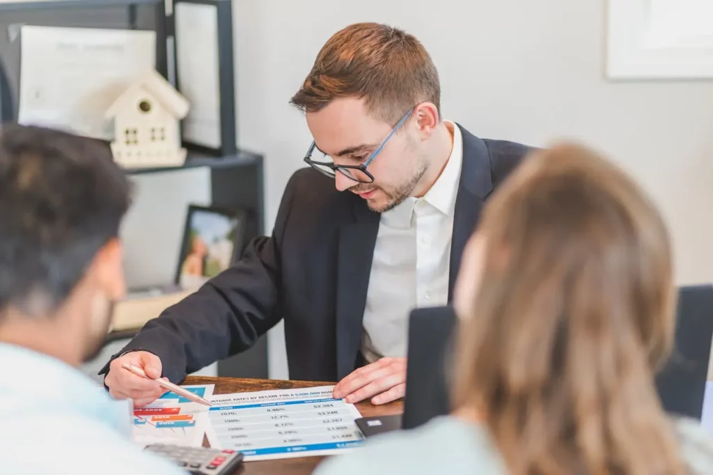 A real estate agent discussing market updates with a client