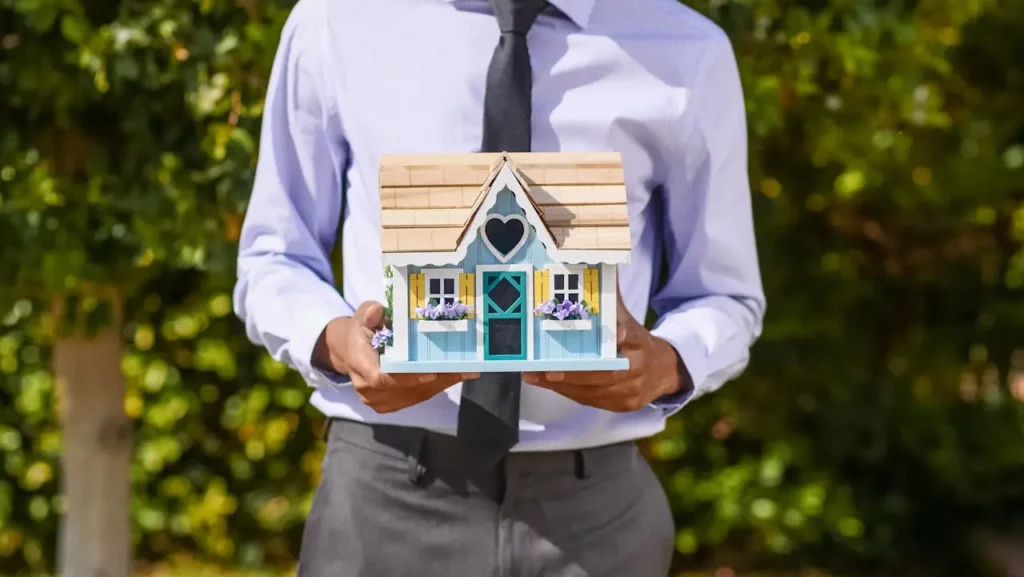 A real estate agent handing out branded gifts to past clients