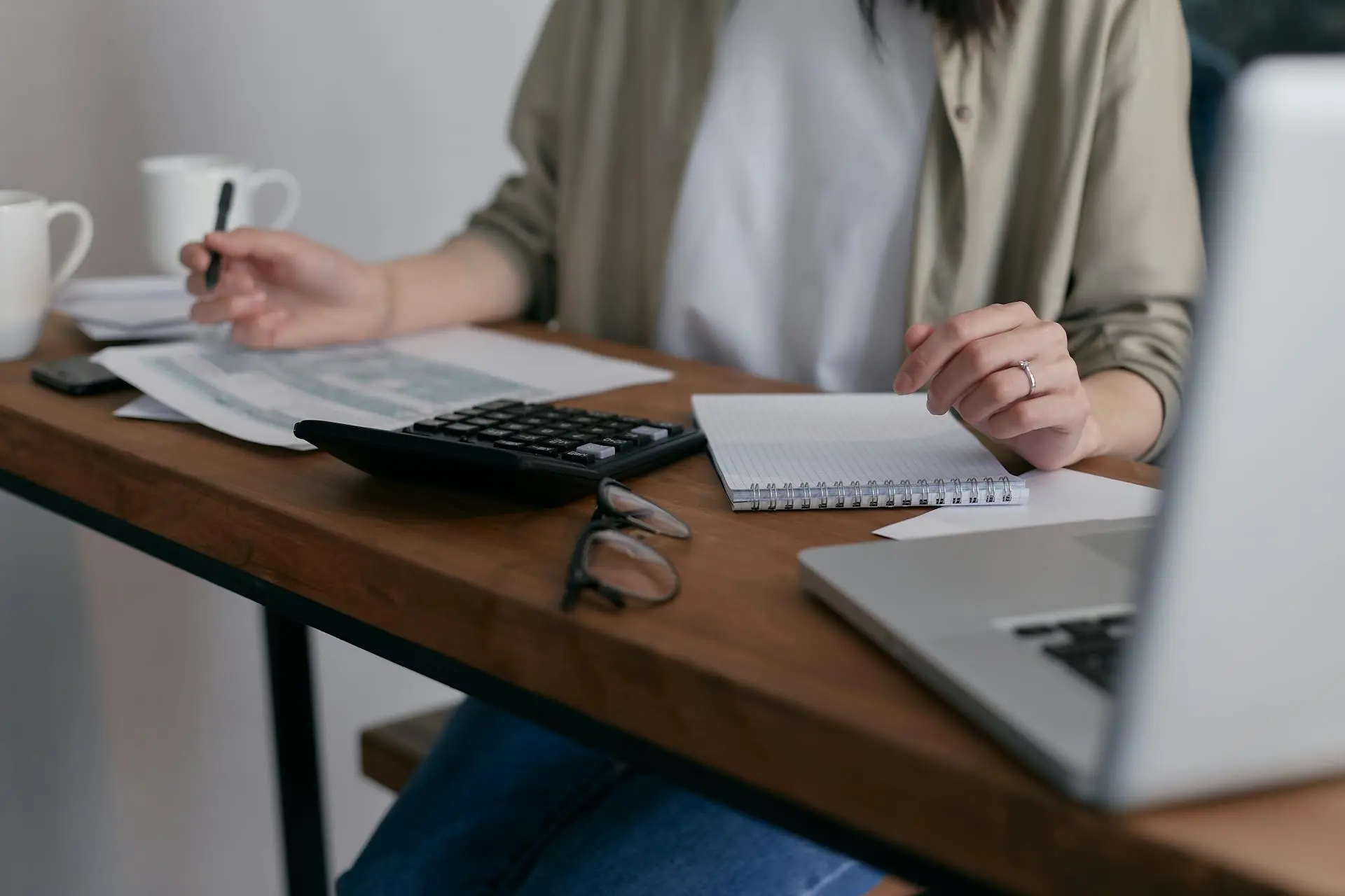 A real estate agent reviewing paperwork for transaction management