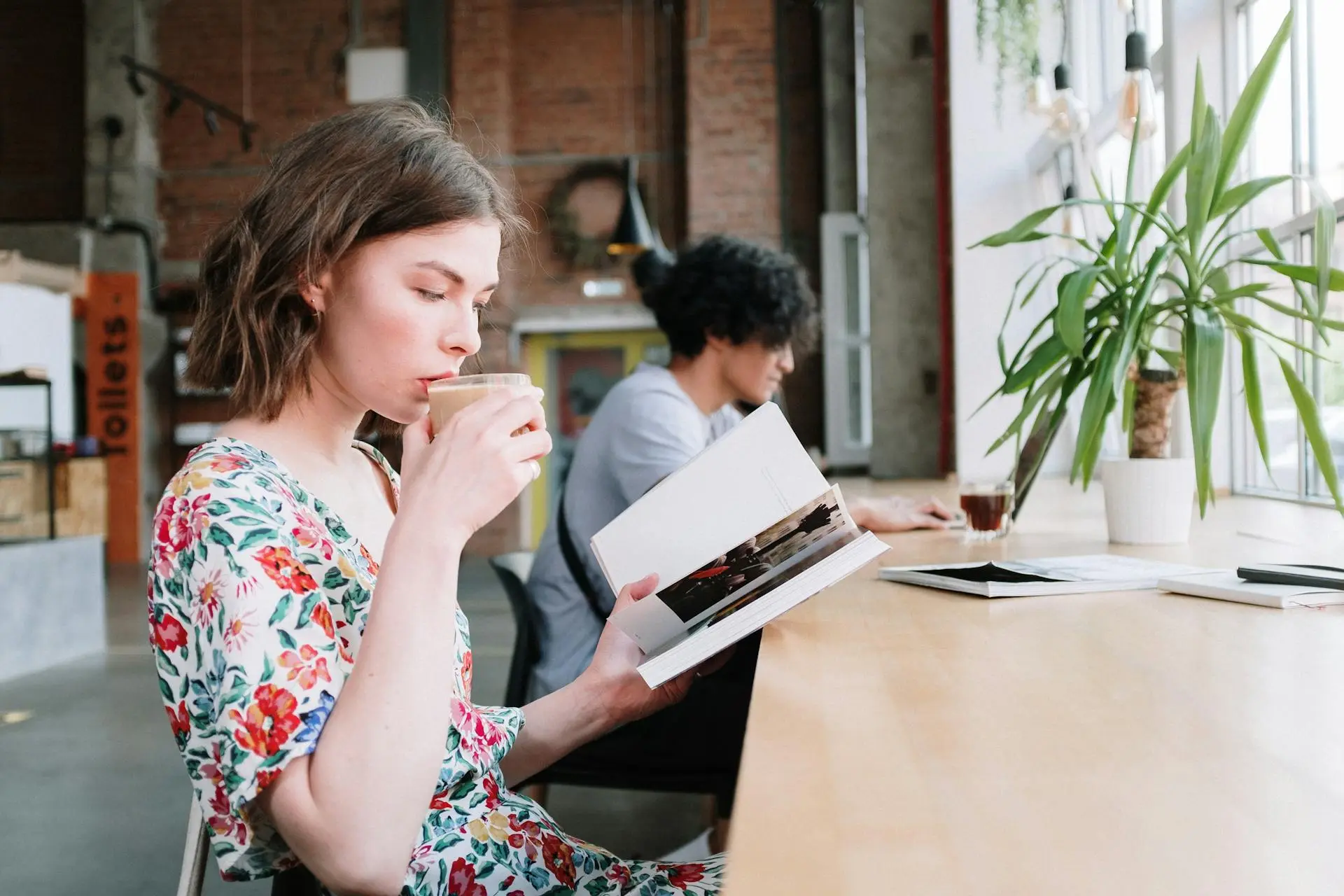 A relaxed realtor taking a coffee break in a cozy setting