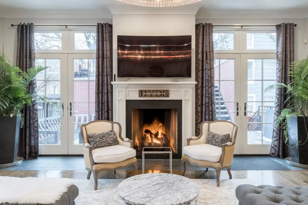 A warm, inviting fireplace with homey decor