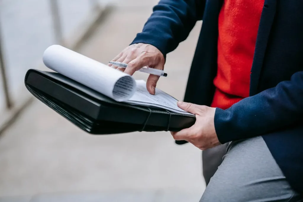 An assistant preparing documents for a real estate client