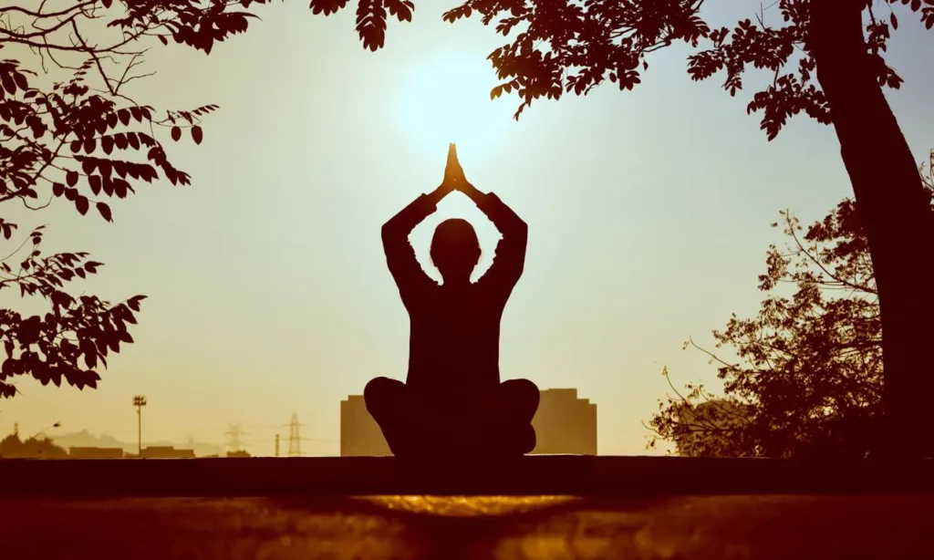 A real estate agent practicing yoga to recharge and avoid burnout