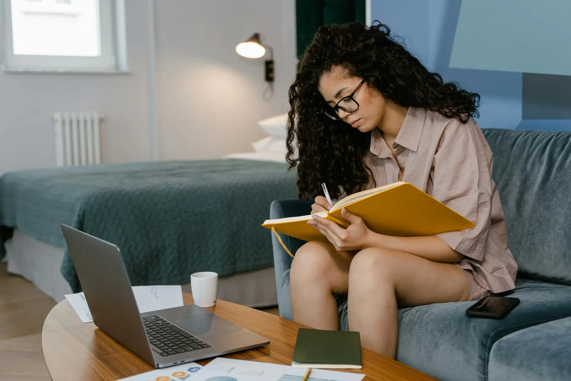 A realtor balancing work and personal life while relaxing in a modern living room