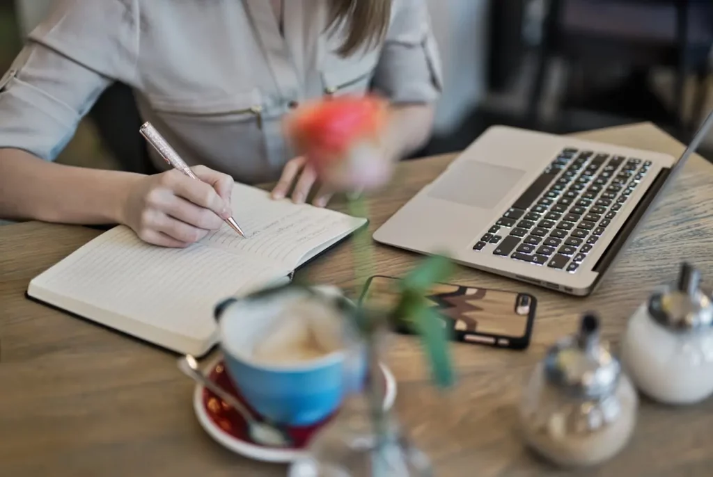 A Realtor setting up automated email templates on a laptop