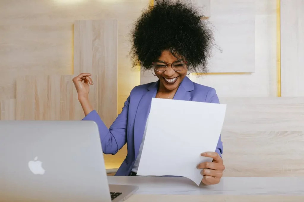 A Realtor sharing a glowing client testimonial on their laptop