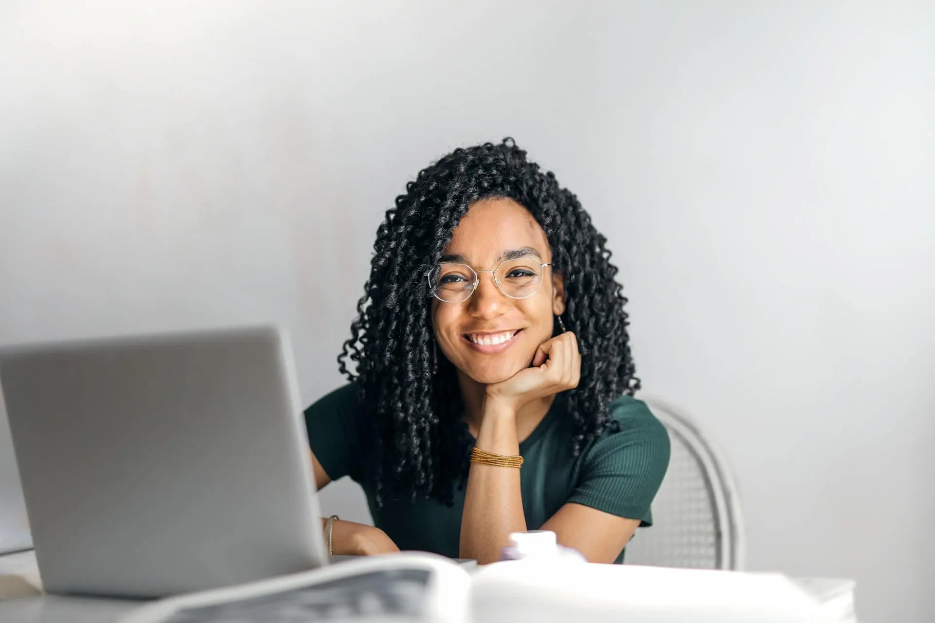 A Realtor working on a laptop, organizing client information in a CRM tool