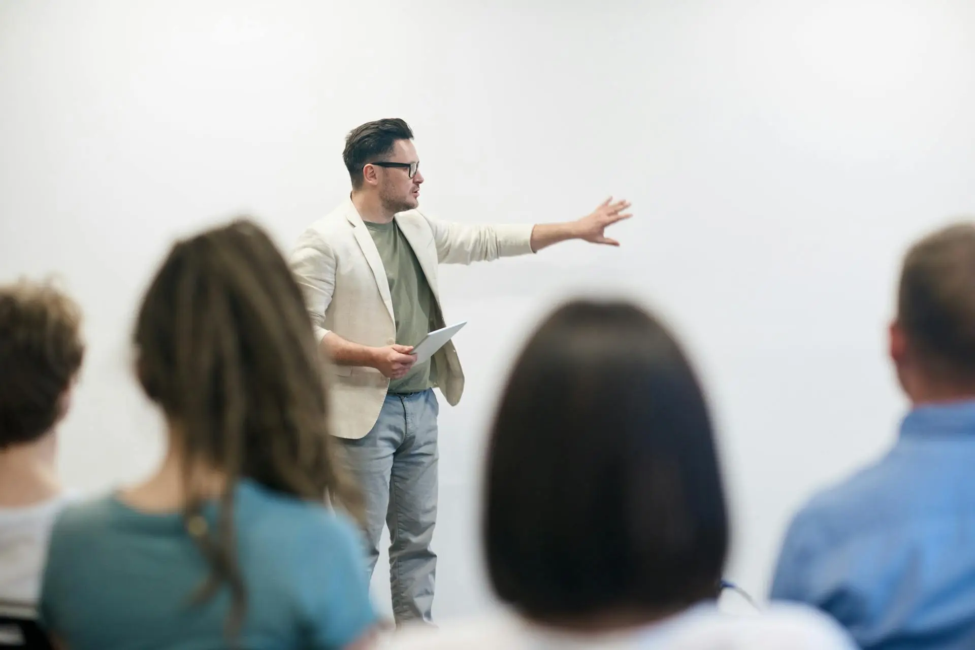 A professional real estate agent presenting a branded portfolio to clients