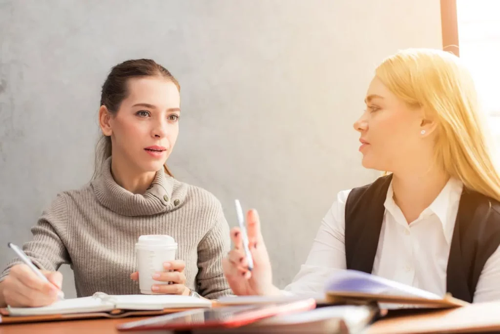 A real estate agent presenting branded marketing materials to a client