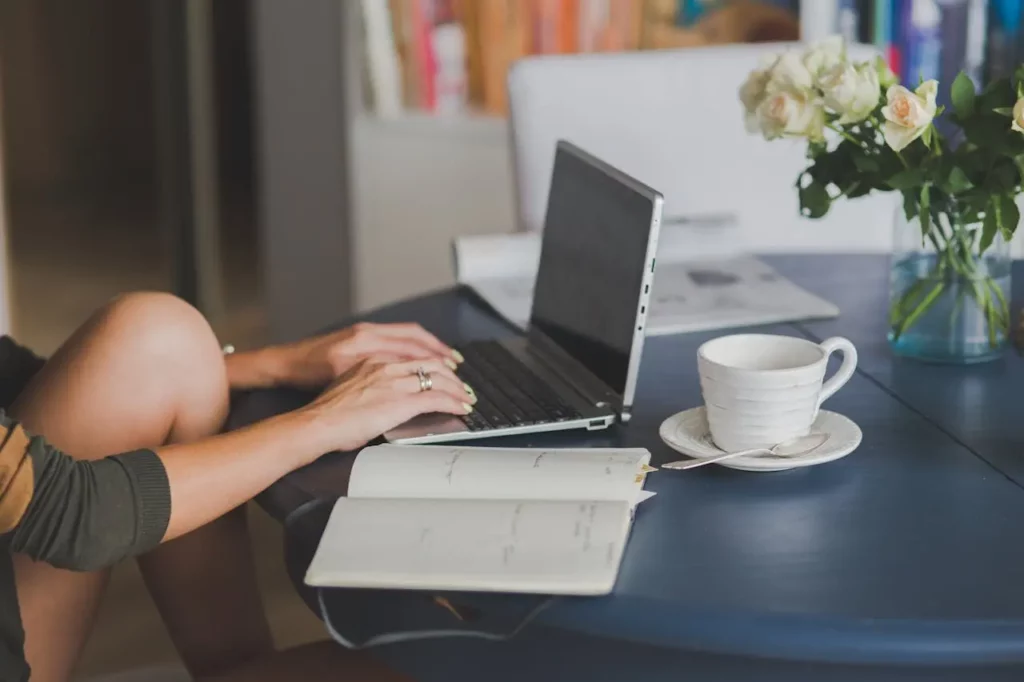 A real estate agent working on personal branding content at a café